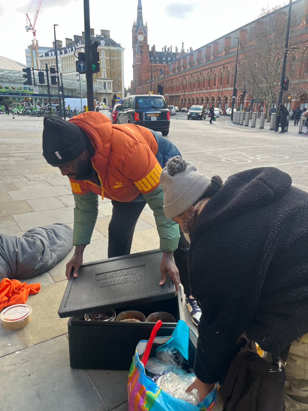 Volunteers serving hot meals on outreach