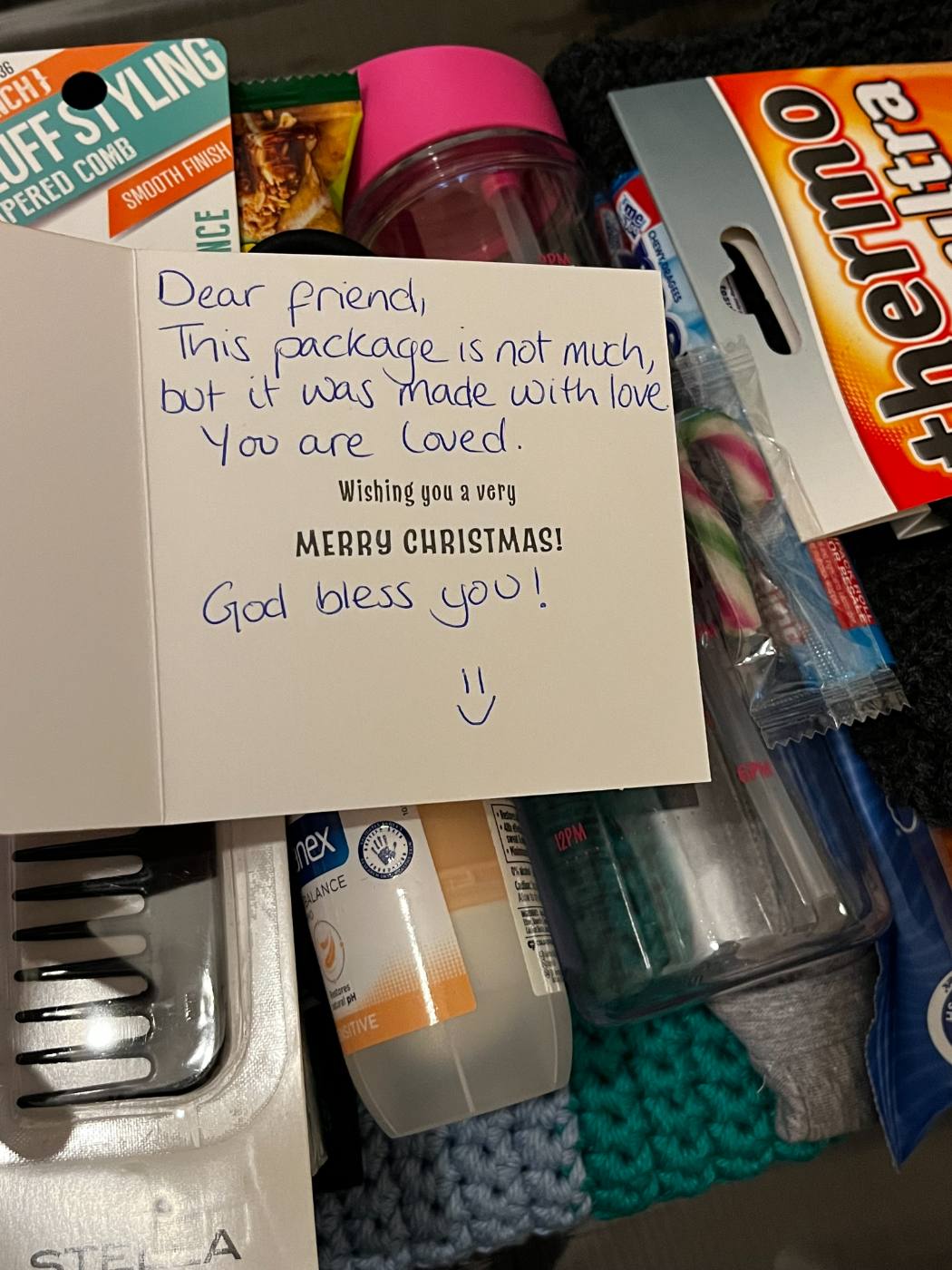 A care package with a handwritten note